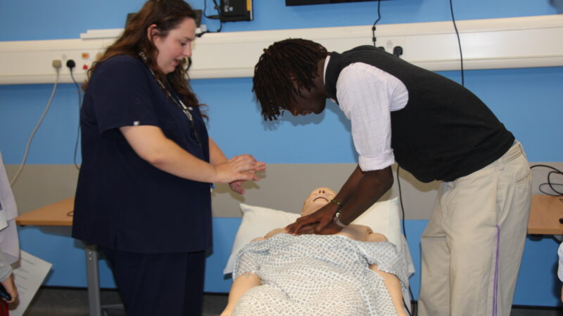 A student takes part in CPR training