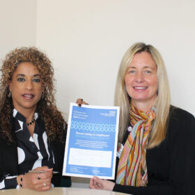 Rachael Metcalf and Roagah Shaher signing the sexual safety charter