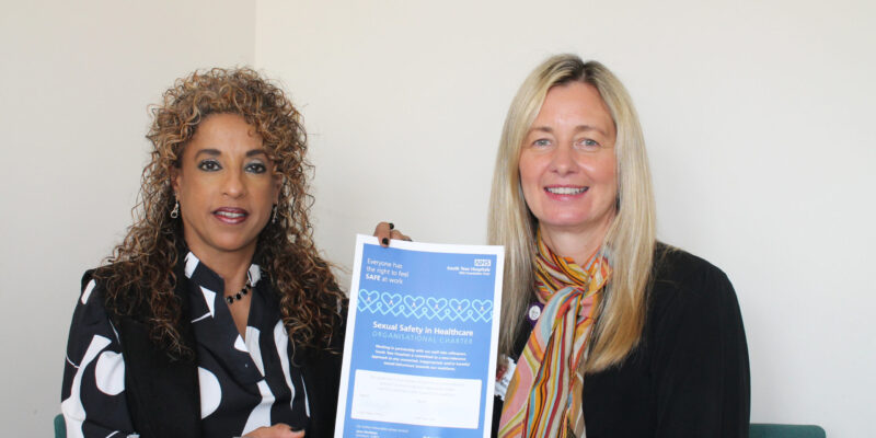Rachael Metcalf and Roagah Shaher signing the sexual safety charter